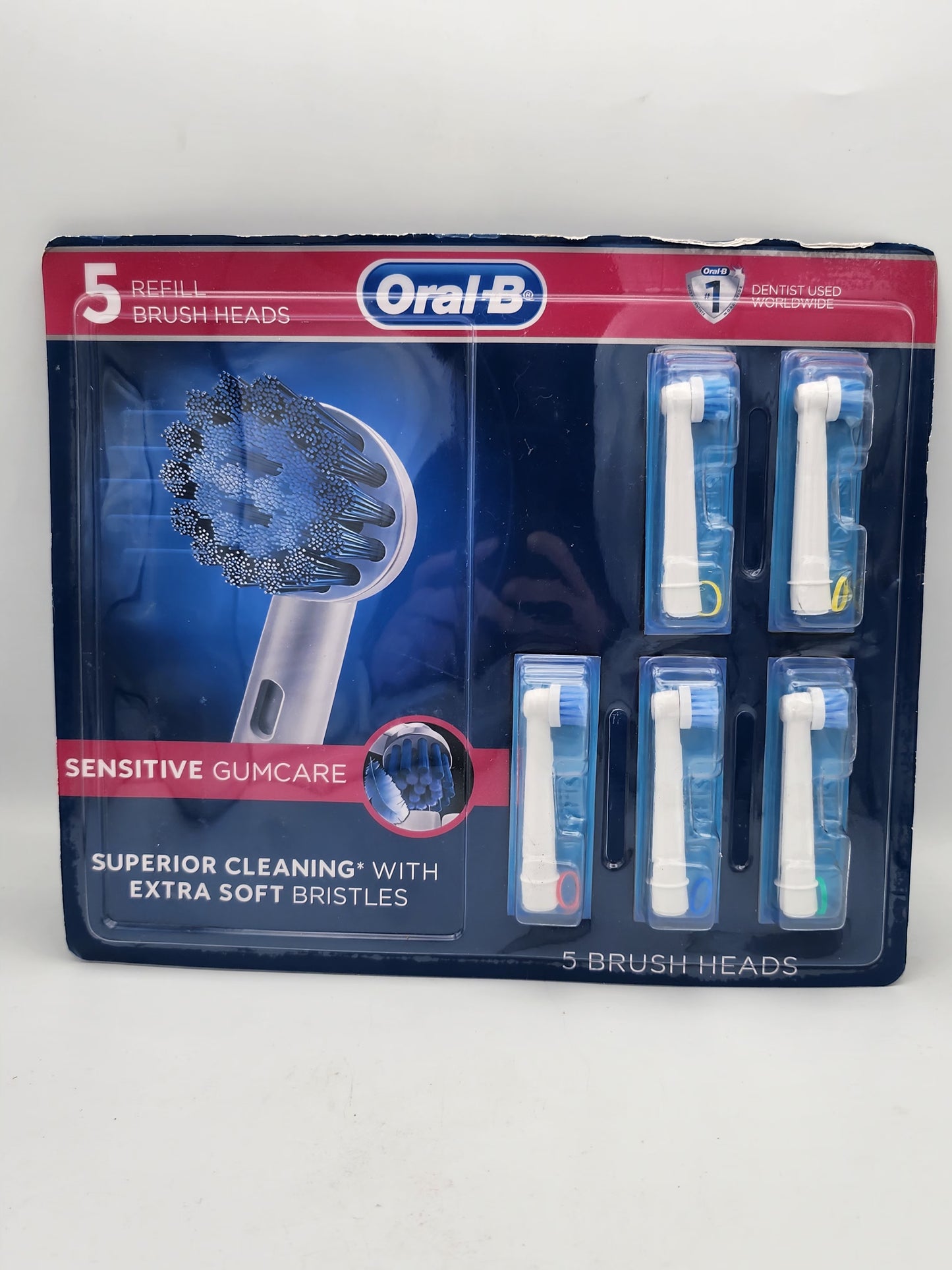 Packaging of Orajel dental care product with brush heads on a white background