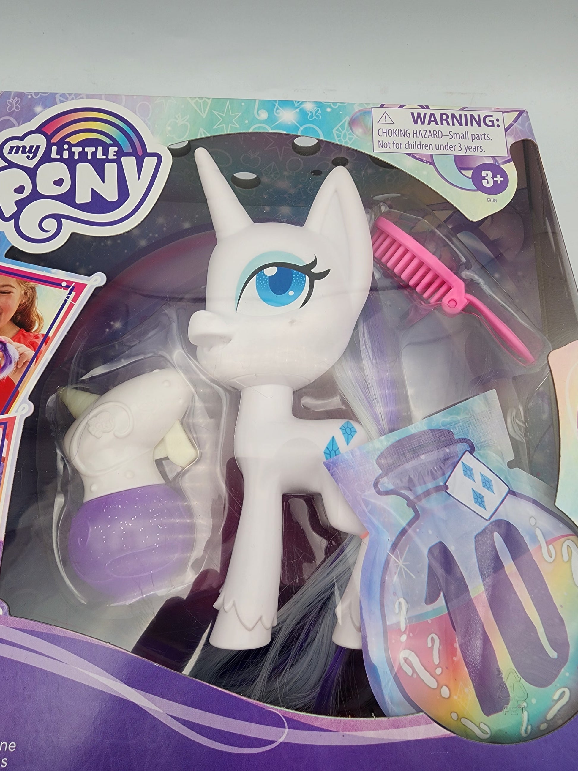 My Little Pony toy figure with packaging featuring a warning label.