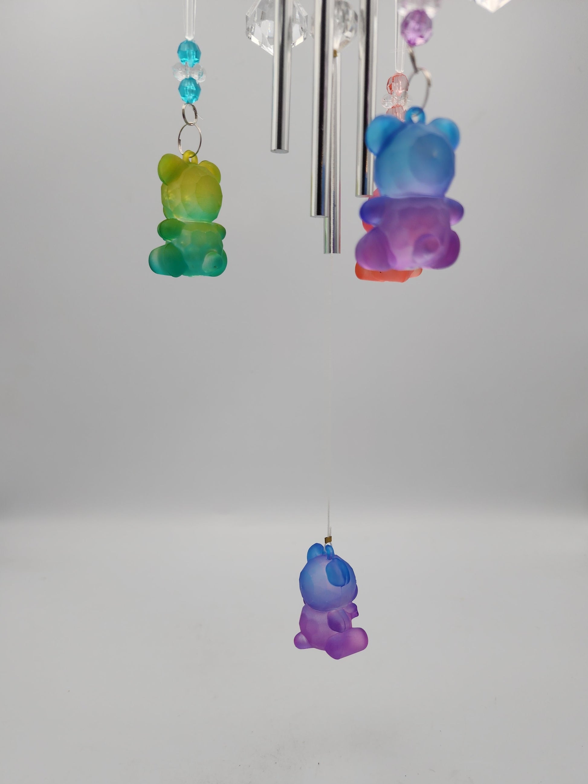Colorful bear-shaped decorations on a white wall