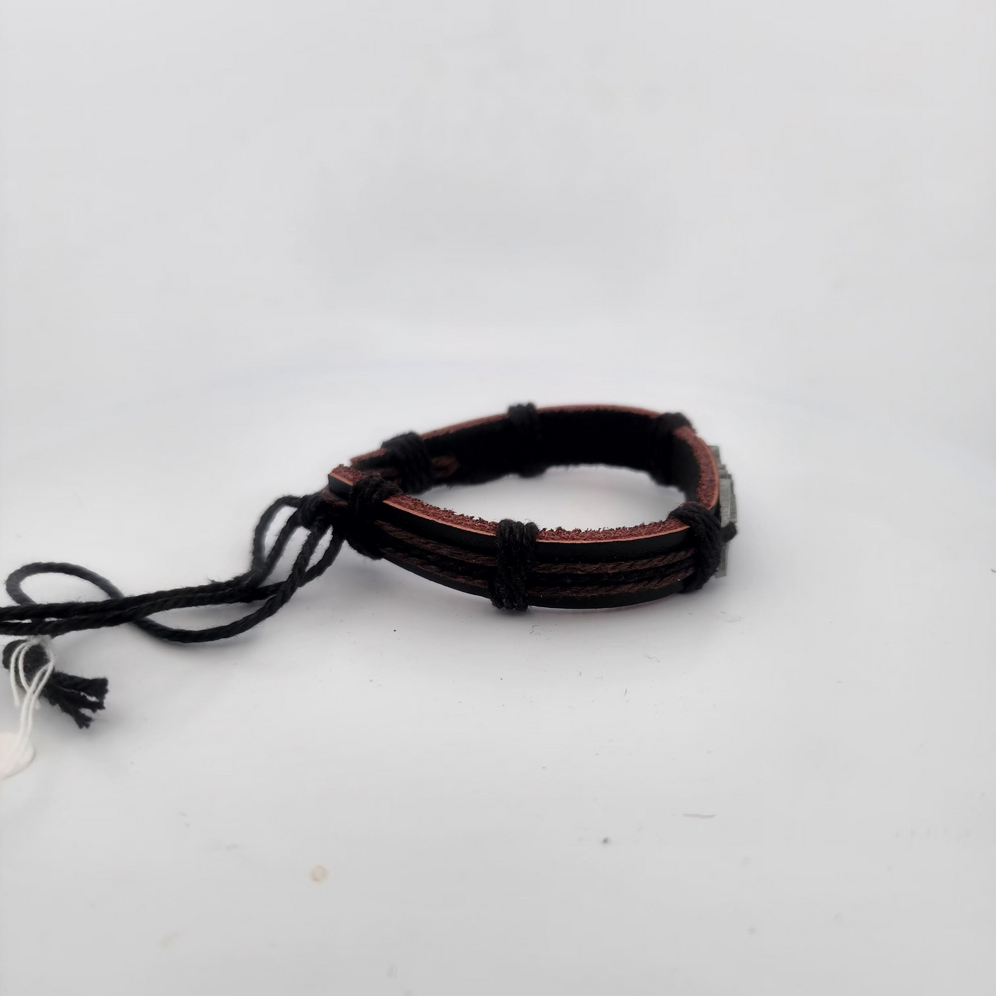 Brown leather bracelet on a white background