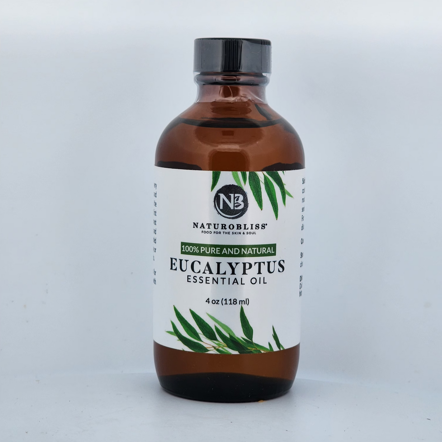 Bottle of eucalyptus essential oil with a white label on a light gray background