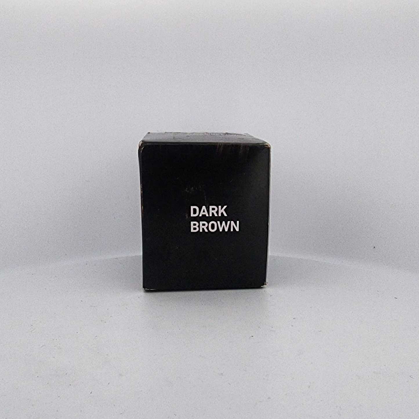 Black box labeled 'Dark Brown' on a white background