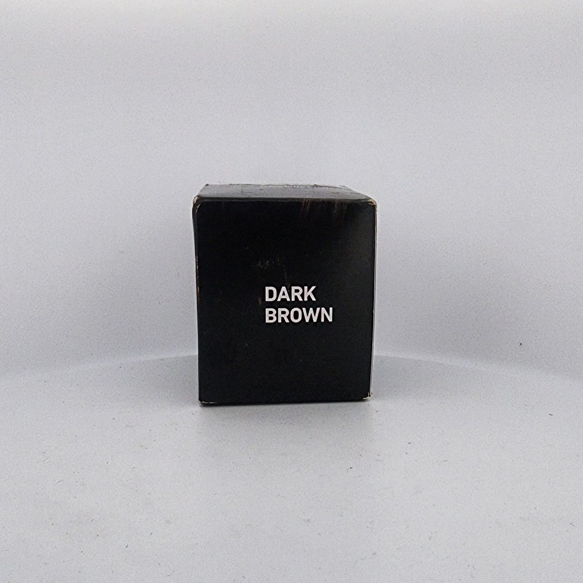 Black box labeled 'Dark Brown' on a white background