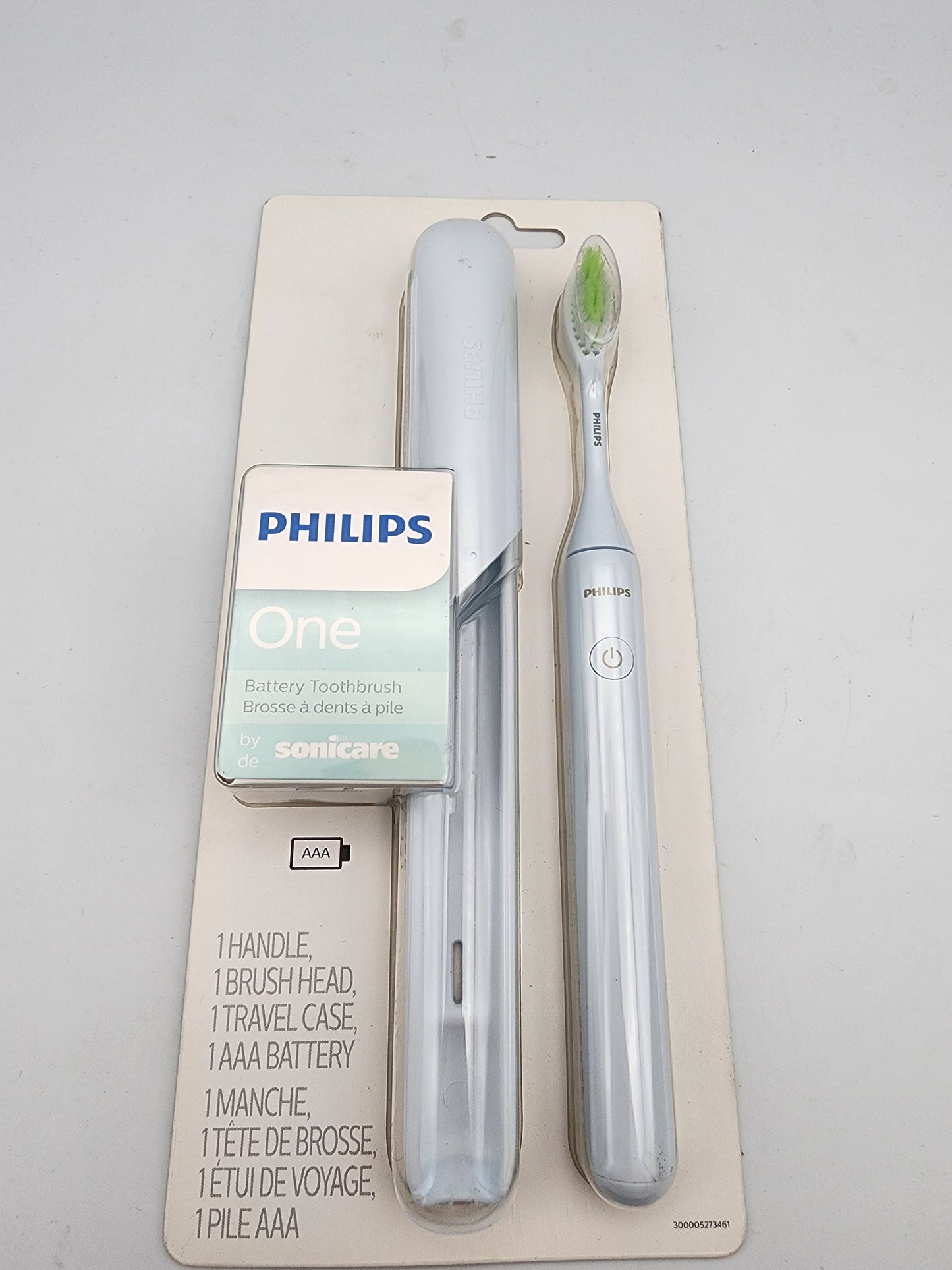 Philips Sonicare electric toothbrush set on a gray background