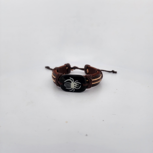 Bracelet with spider design on a white surface