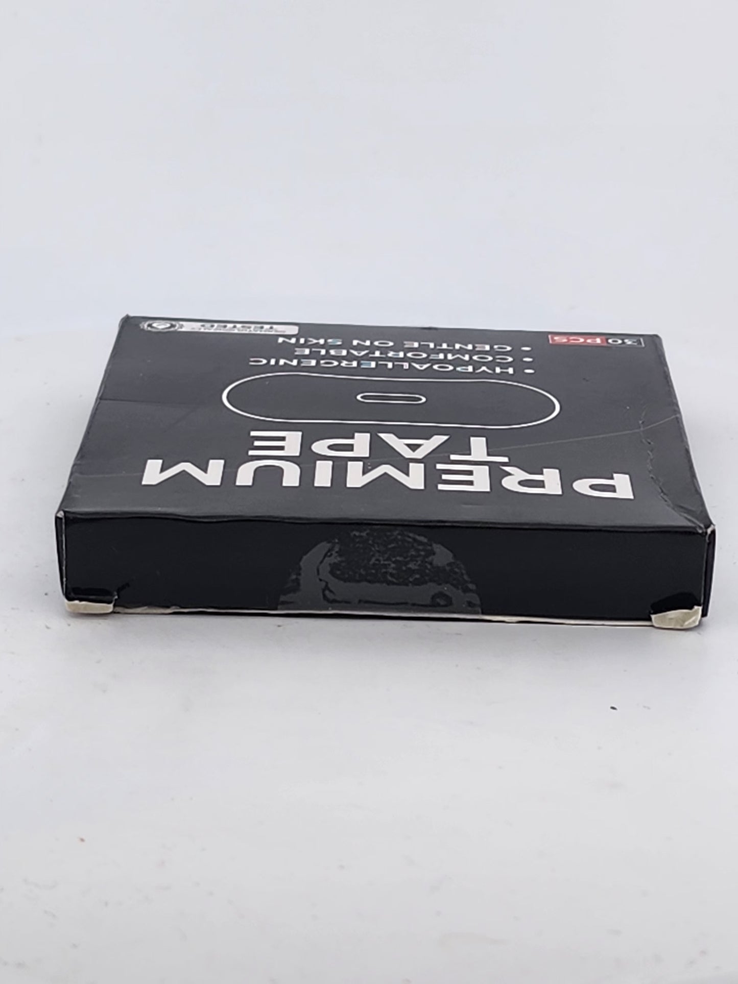 Box of premium tape on a white background