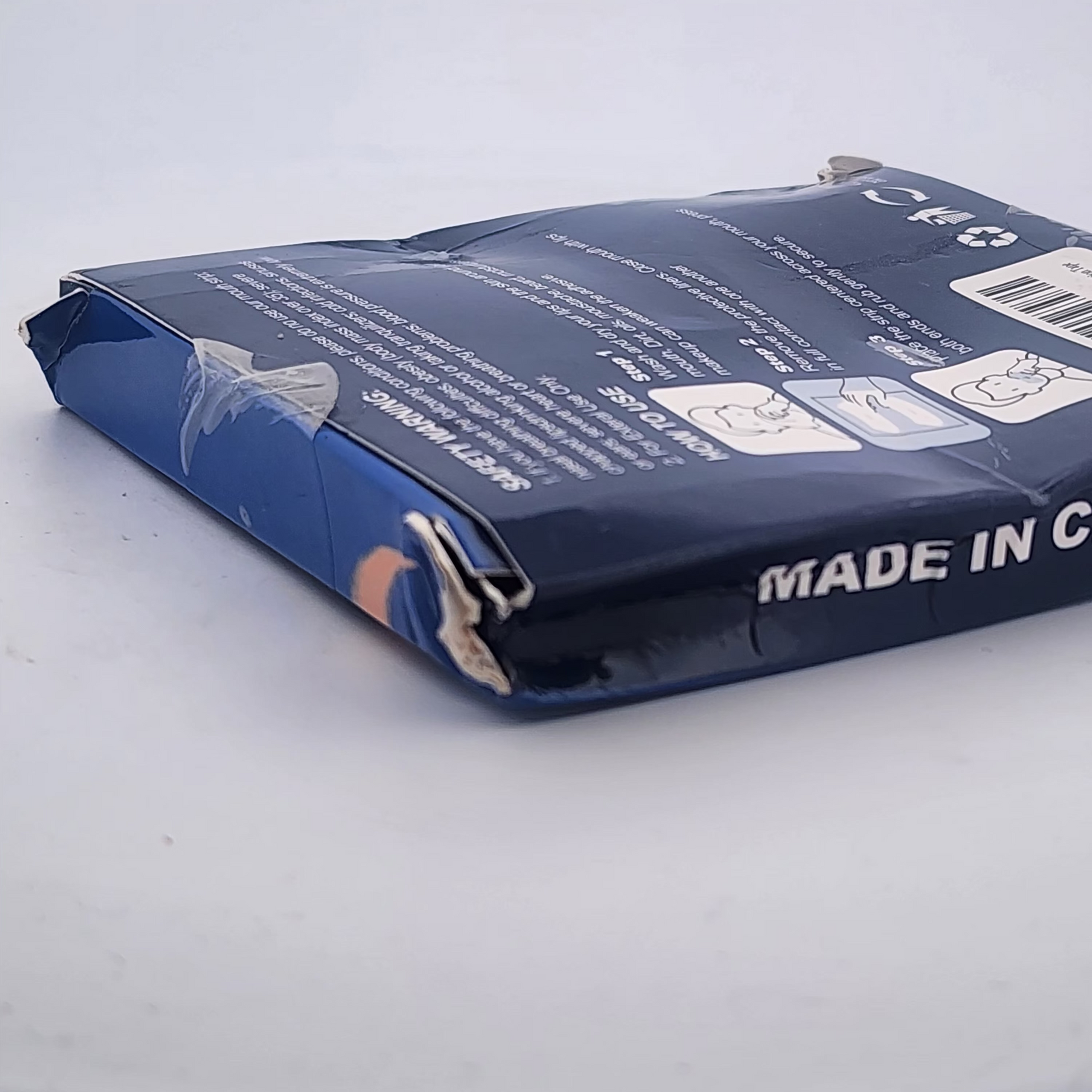 Blue tape dispenser packaging with 'Premium Quality Tape' text on a light gray background