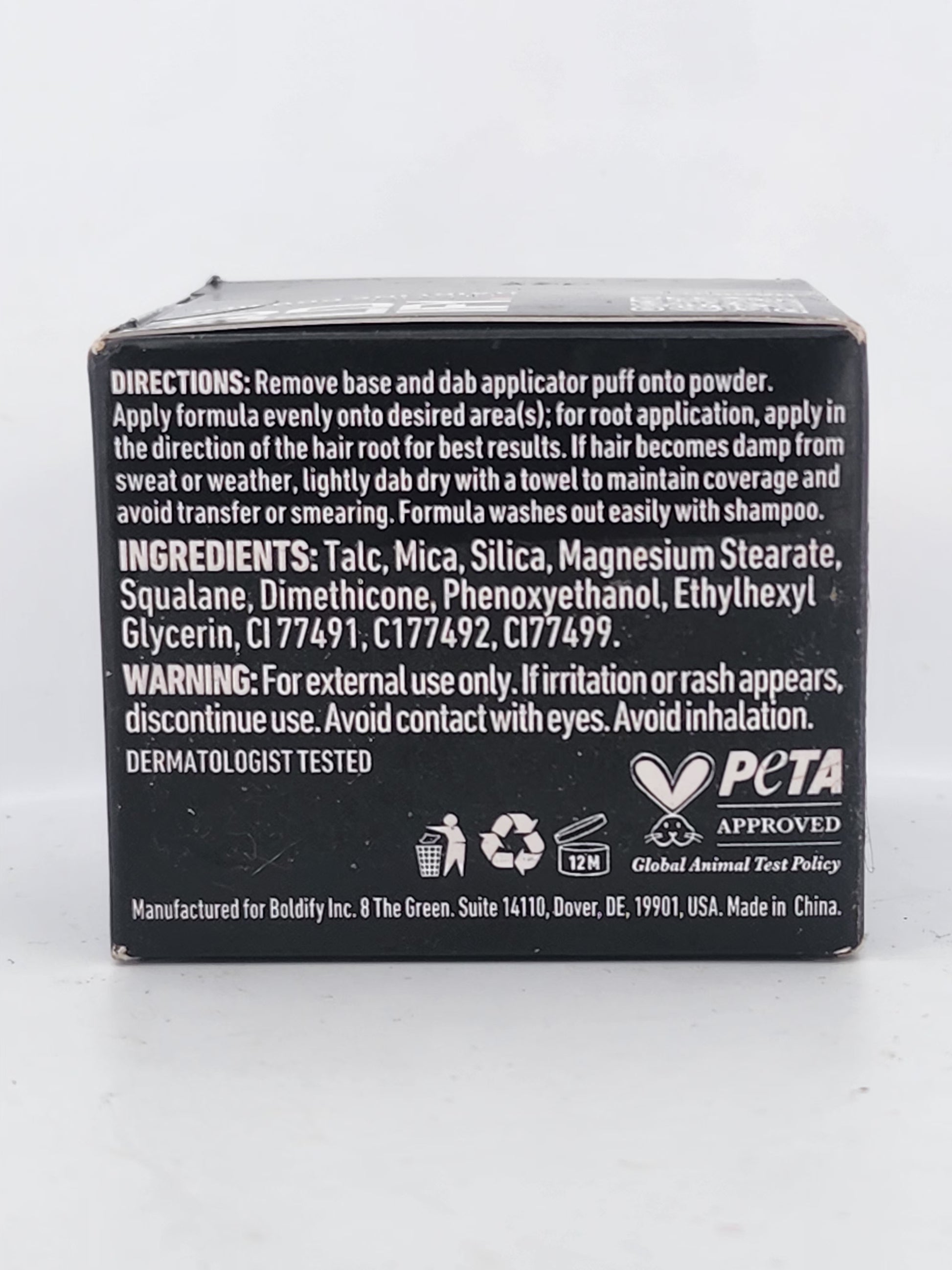 Back of a black box with text and logos on a white background