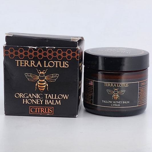 Terra Lotus Organic Tallow Honey Balm jar and packaging on a white surface