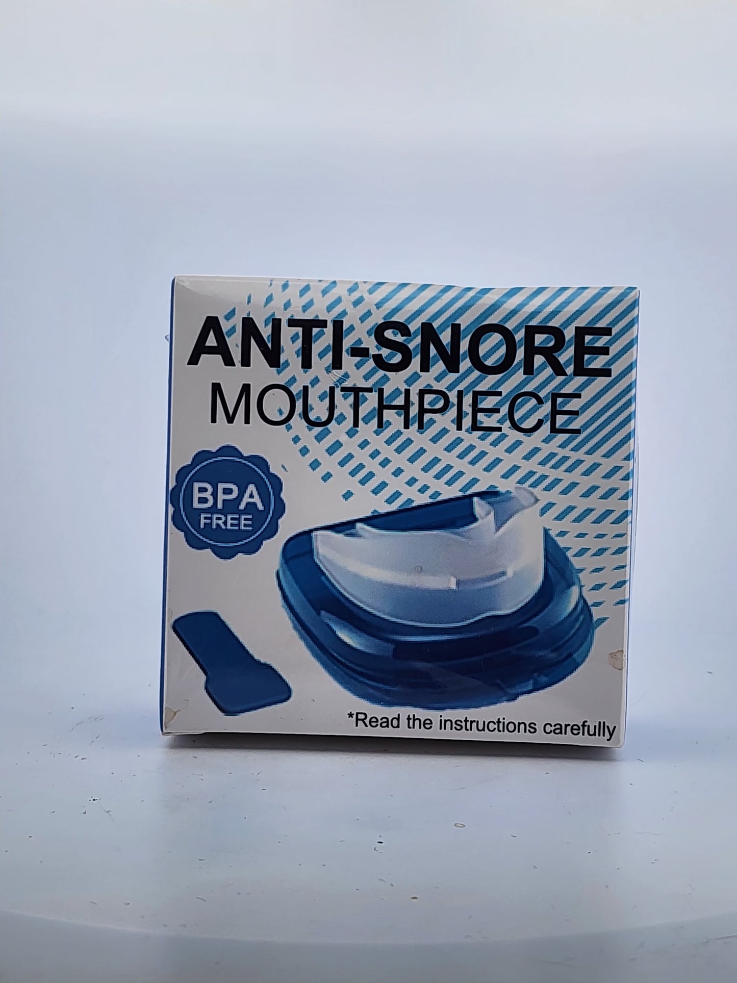 Box of an anti-snore mouthpiece with blue and white design on a light gray background