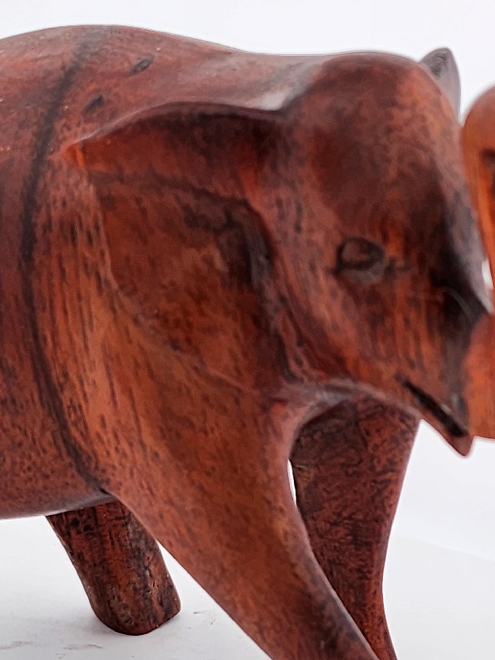 Wooden elephant sculpture on a white background