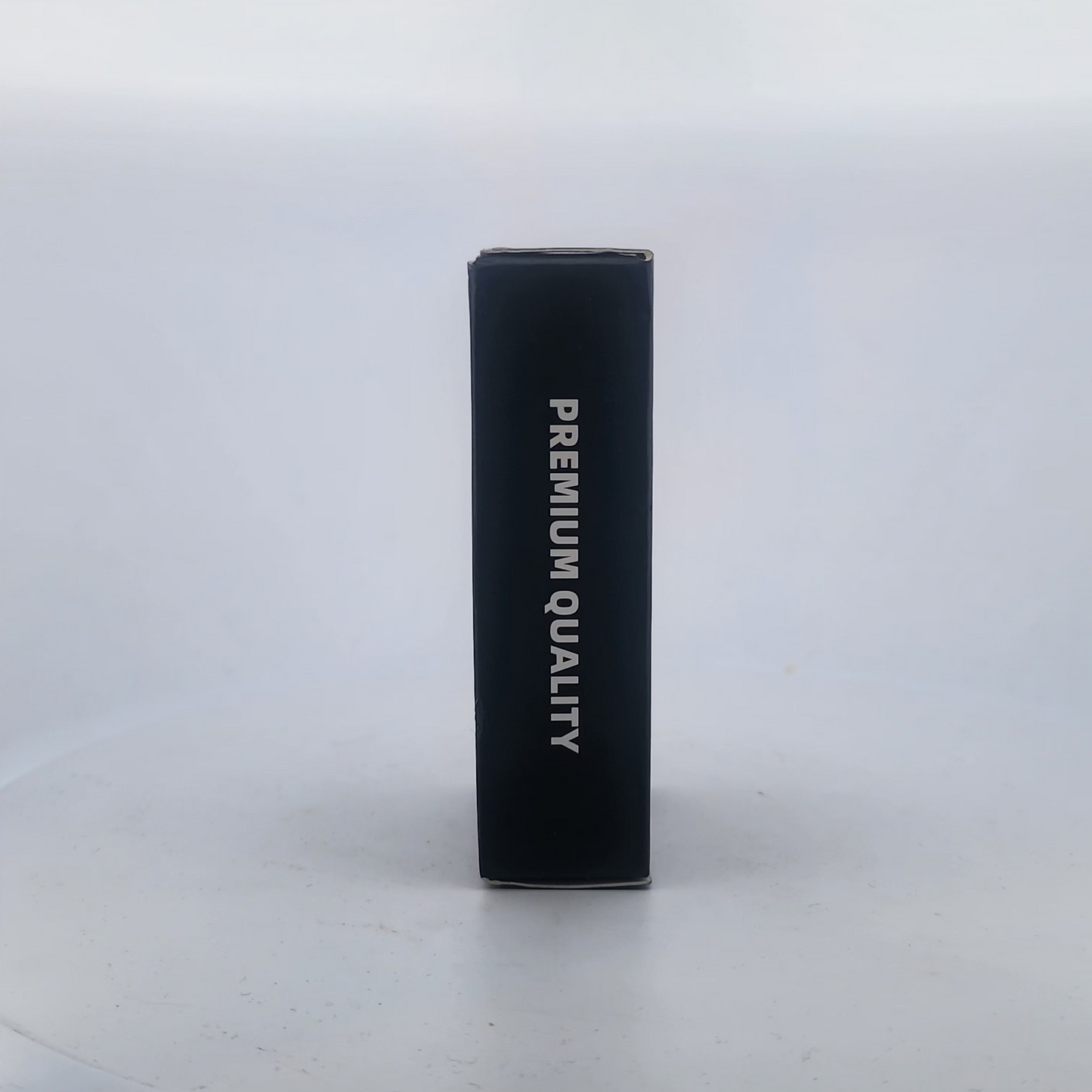 Black cylindrical container with 'PREMIUM QUALITY' text on a white background