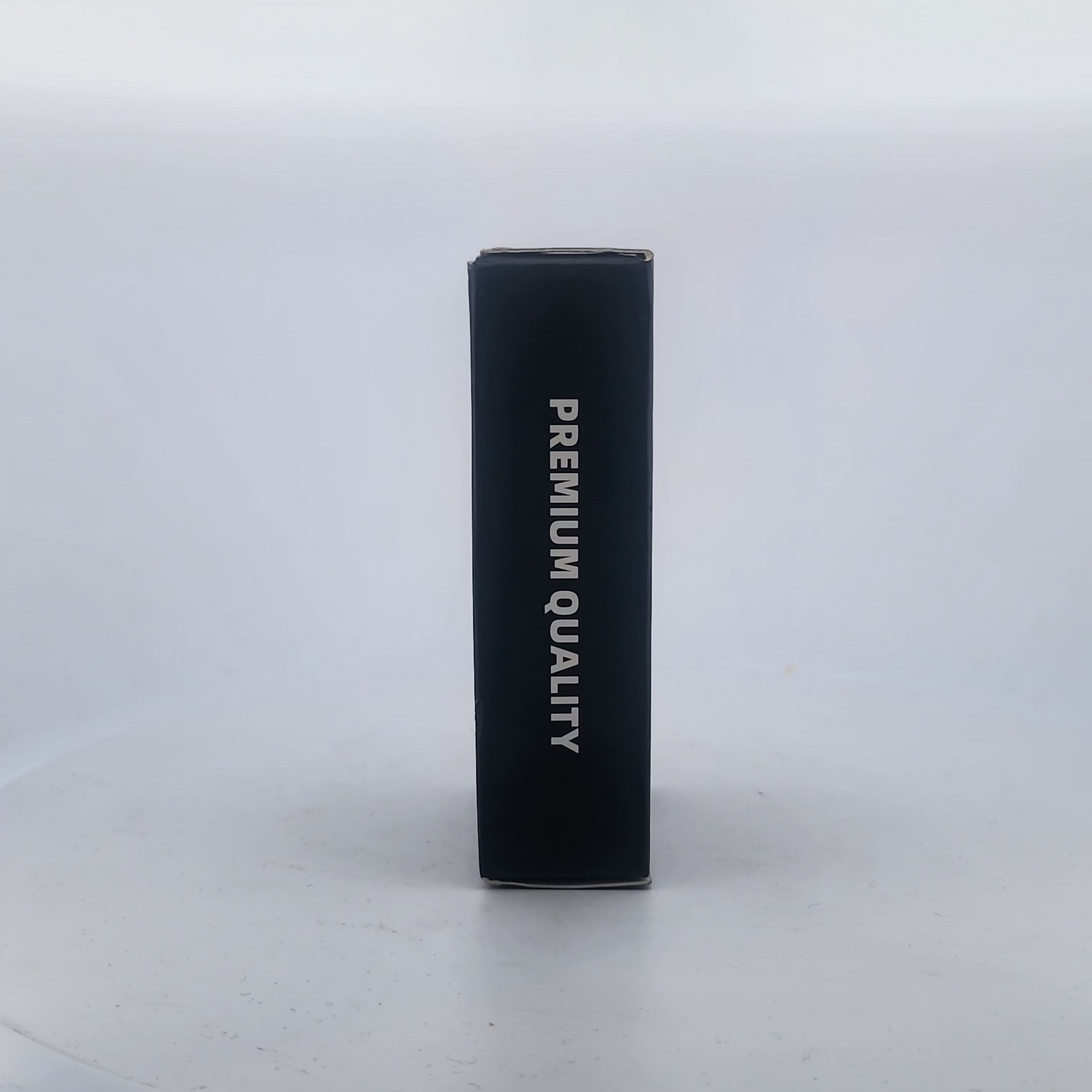 Black cylindrical container with 'PREMIUM QUALITY' text on a white background