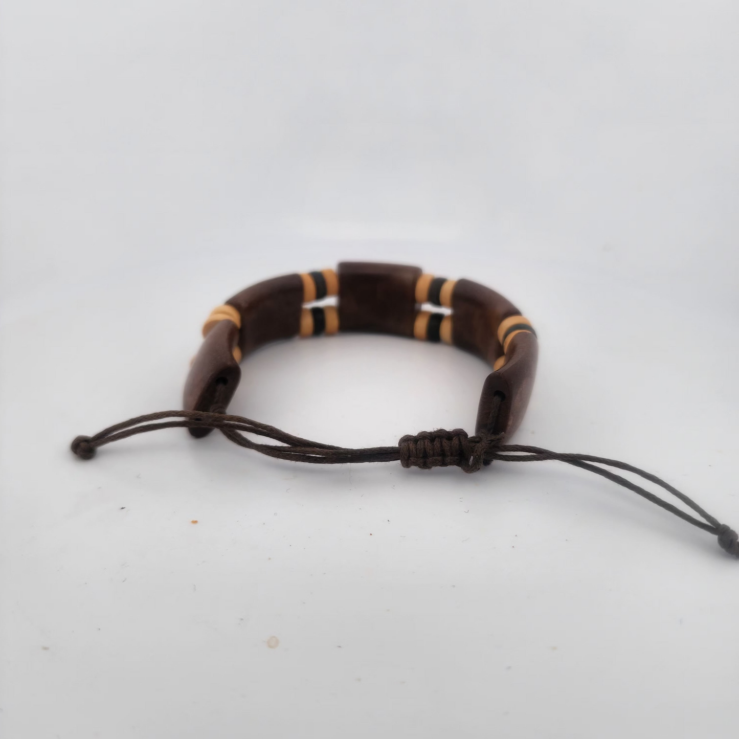 Brown beaded bracelet on a white background