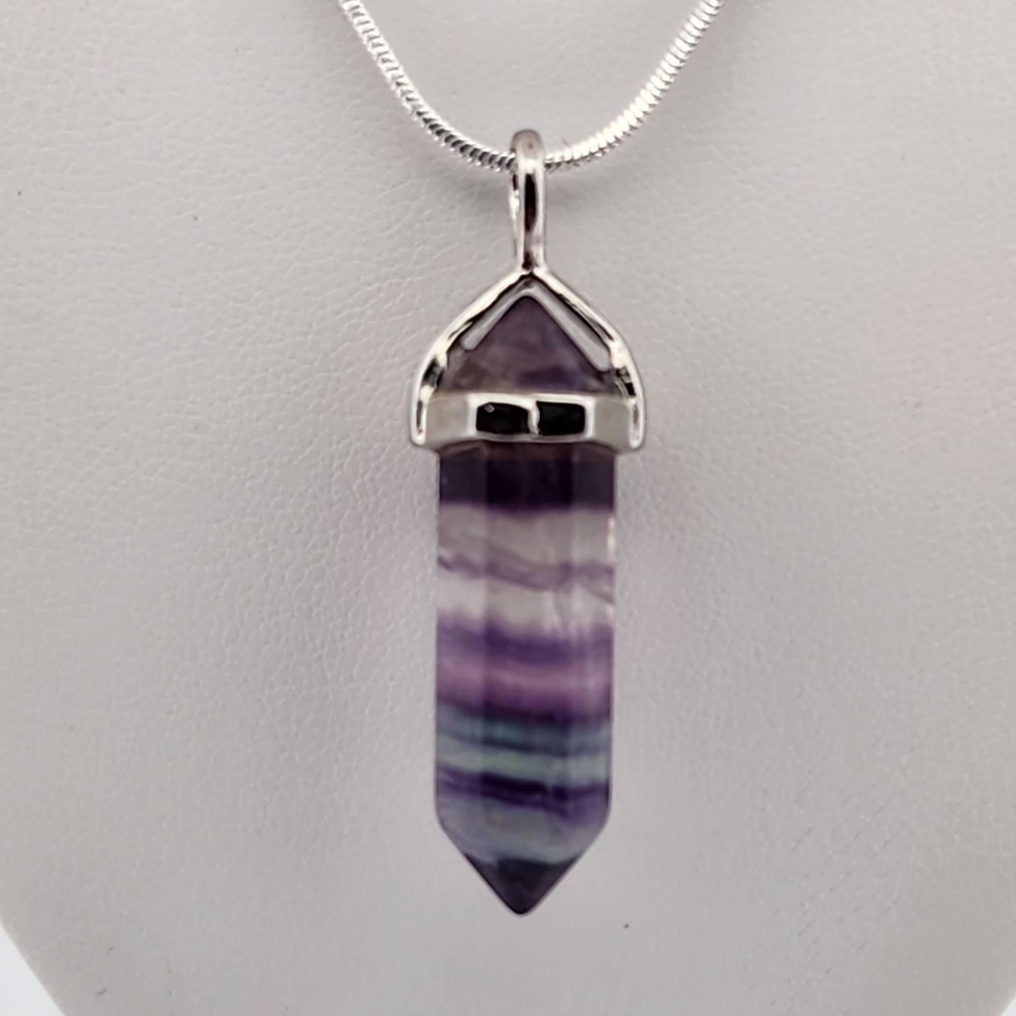 Crystal pendant necklace on a white background
