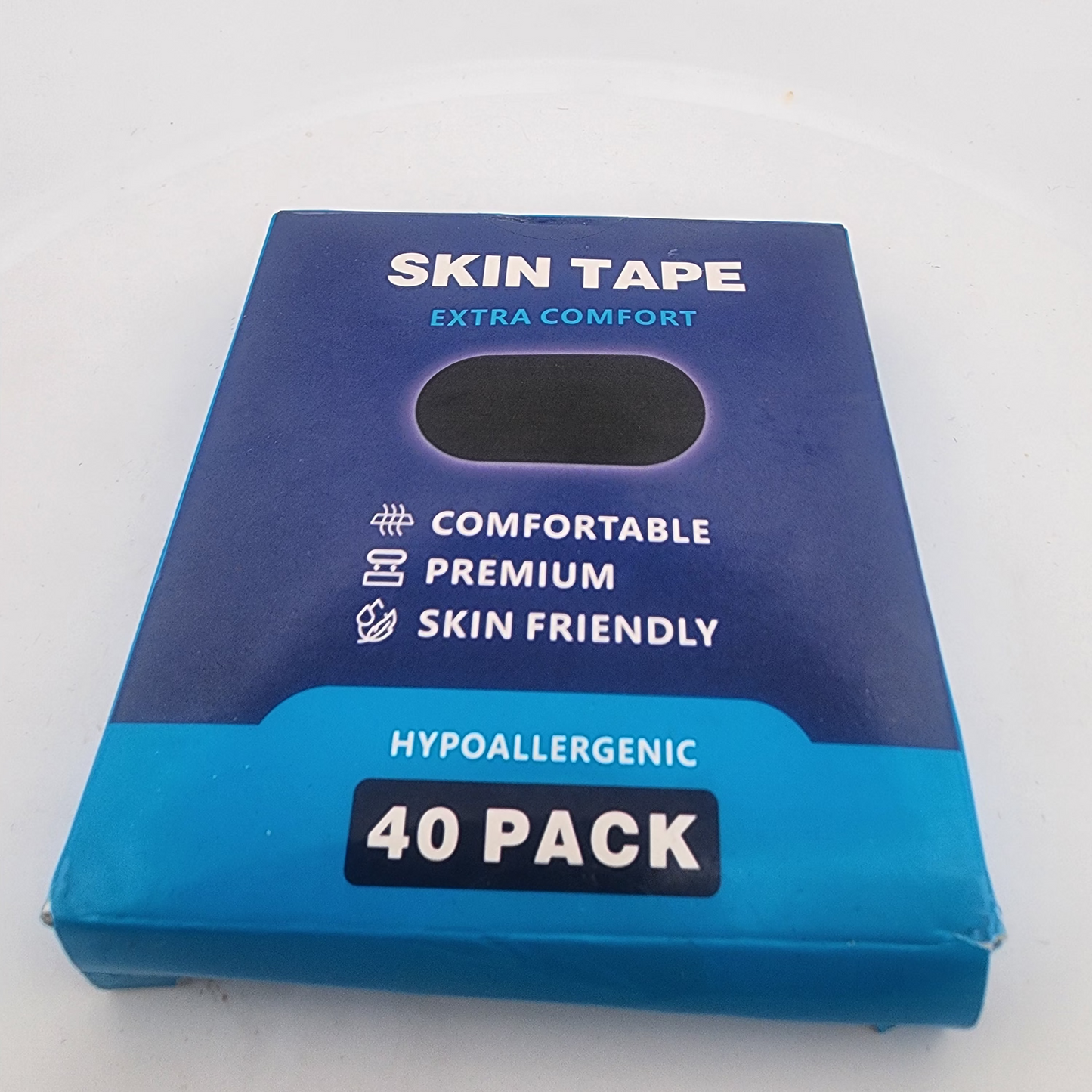 Box of skin tape with blue and white design on a white background