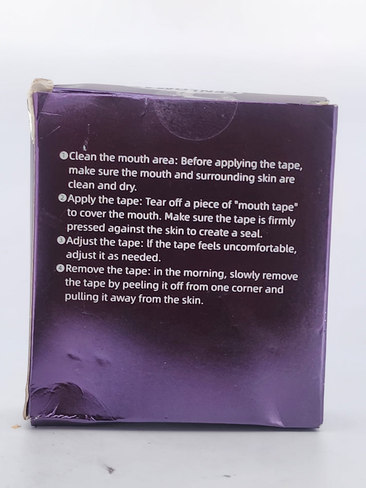 Purple packaging with text instructions on a white background