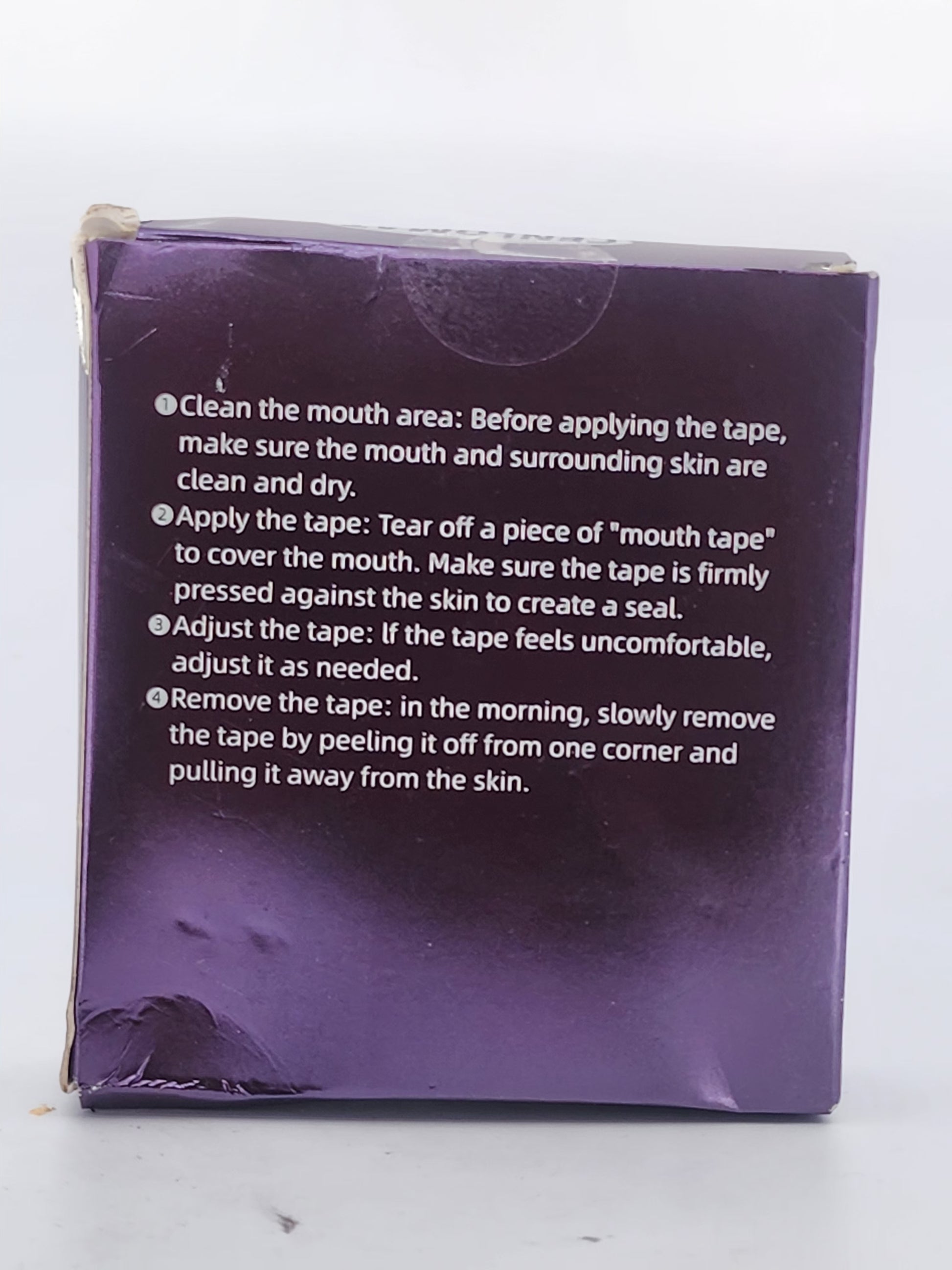 Purple packaging with text instructions on a white background