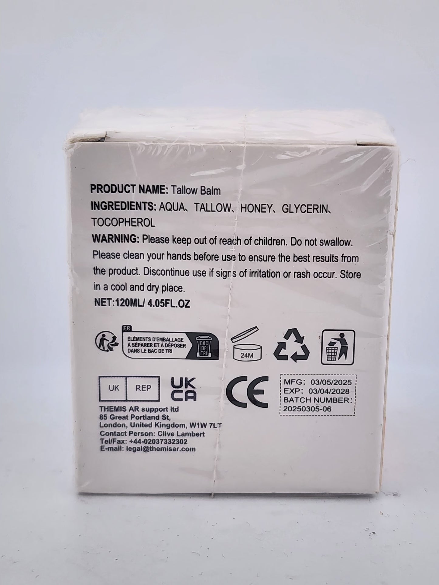 Back of a Tallow Balm packaging with product details and warnings on a white background