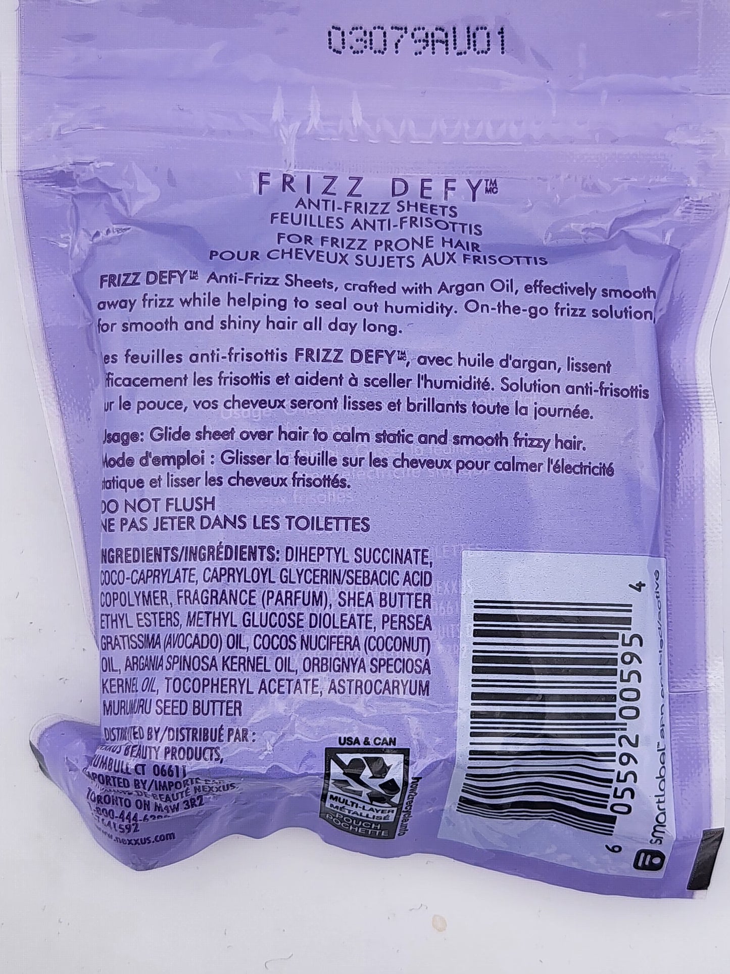 Back of a purple Frizz Defy anti-frizz sheet packaging with text and a barcode.