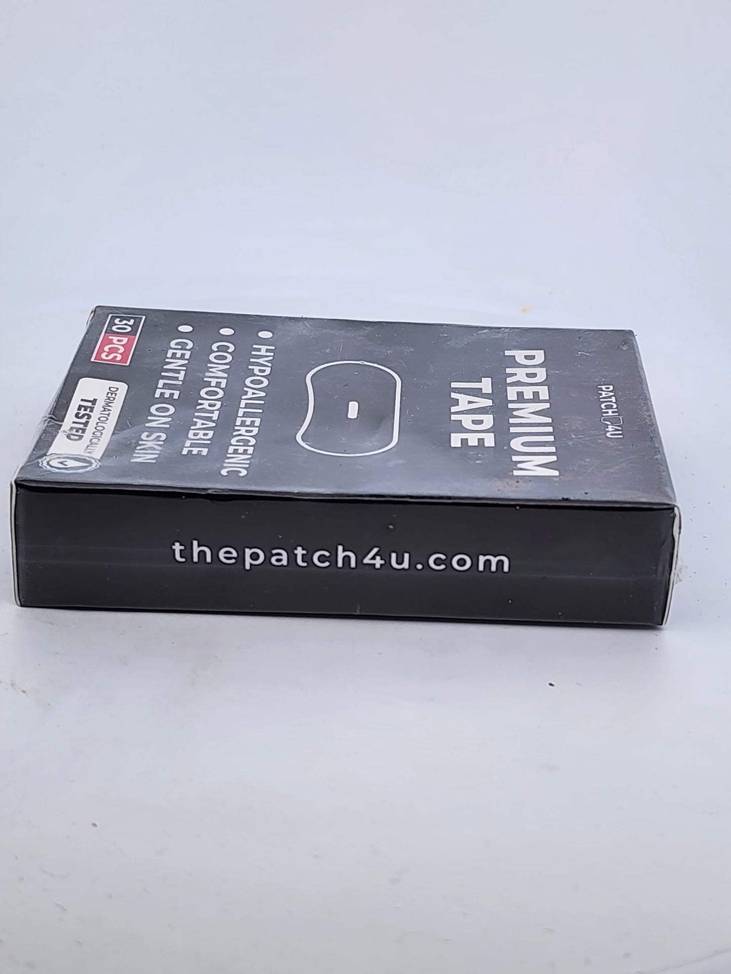 Box of premium tape with branding on a white background