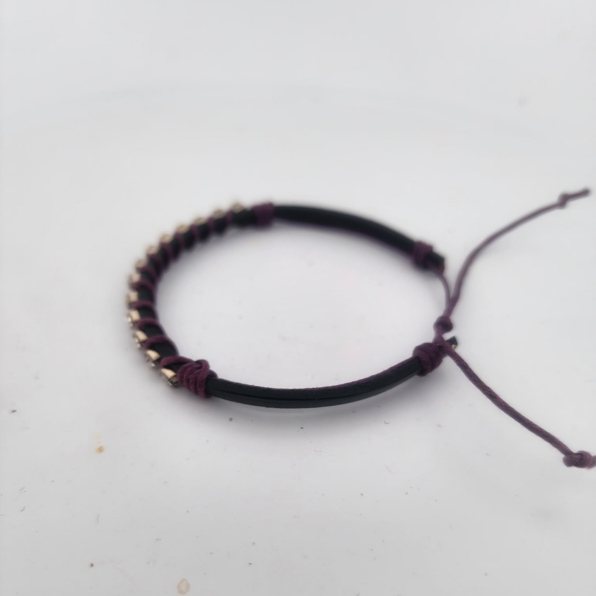 Bracelet with beads on a light gray background