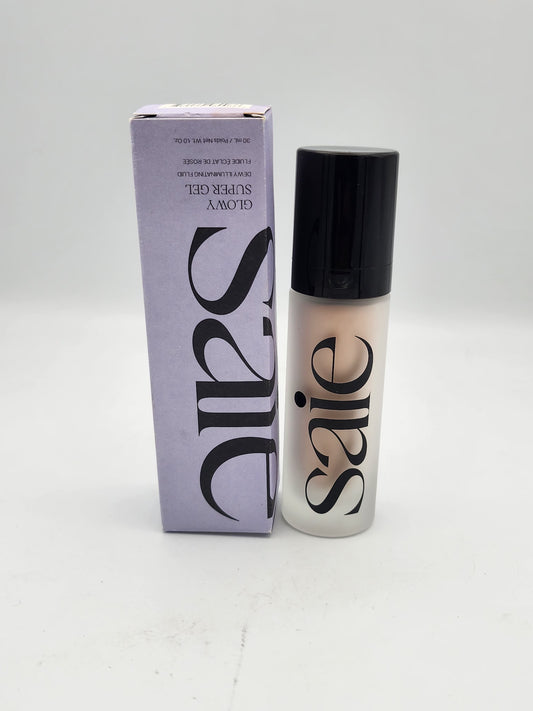 Saie Glowy Super Gel Highlighter Starglow with purple box and illuminating fluid bottle
