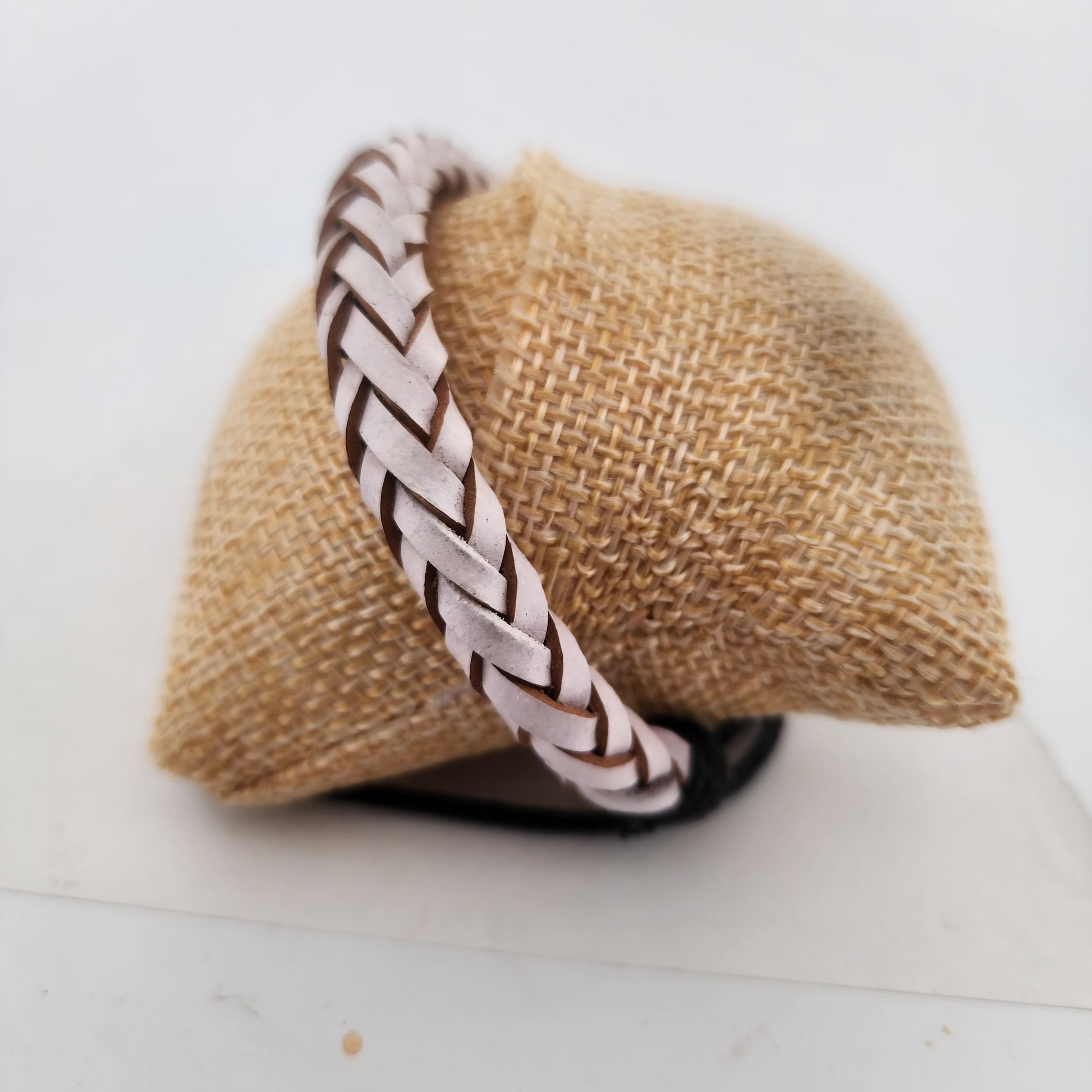 Bracelet with braided design on a textured surface