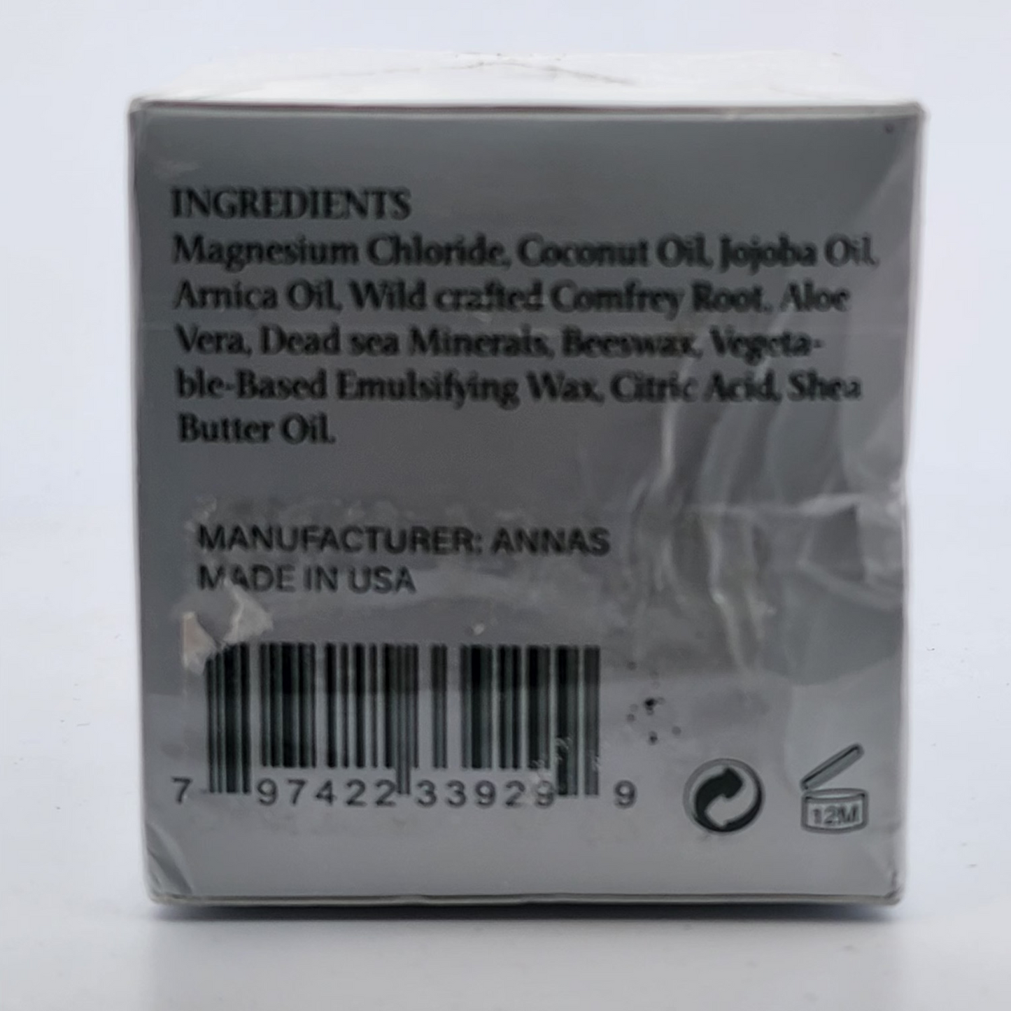 Back of a product packaging with ingredients list and barcode on a white background