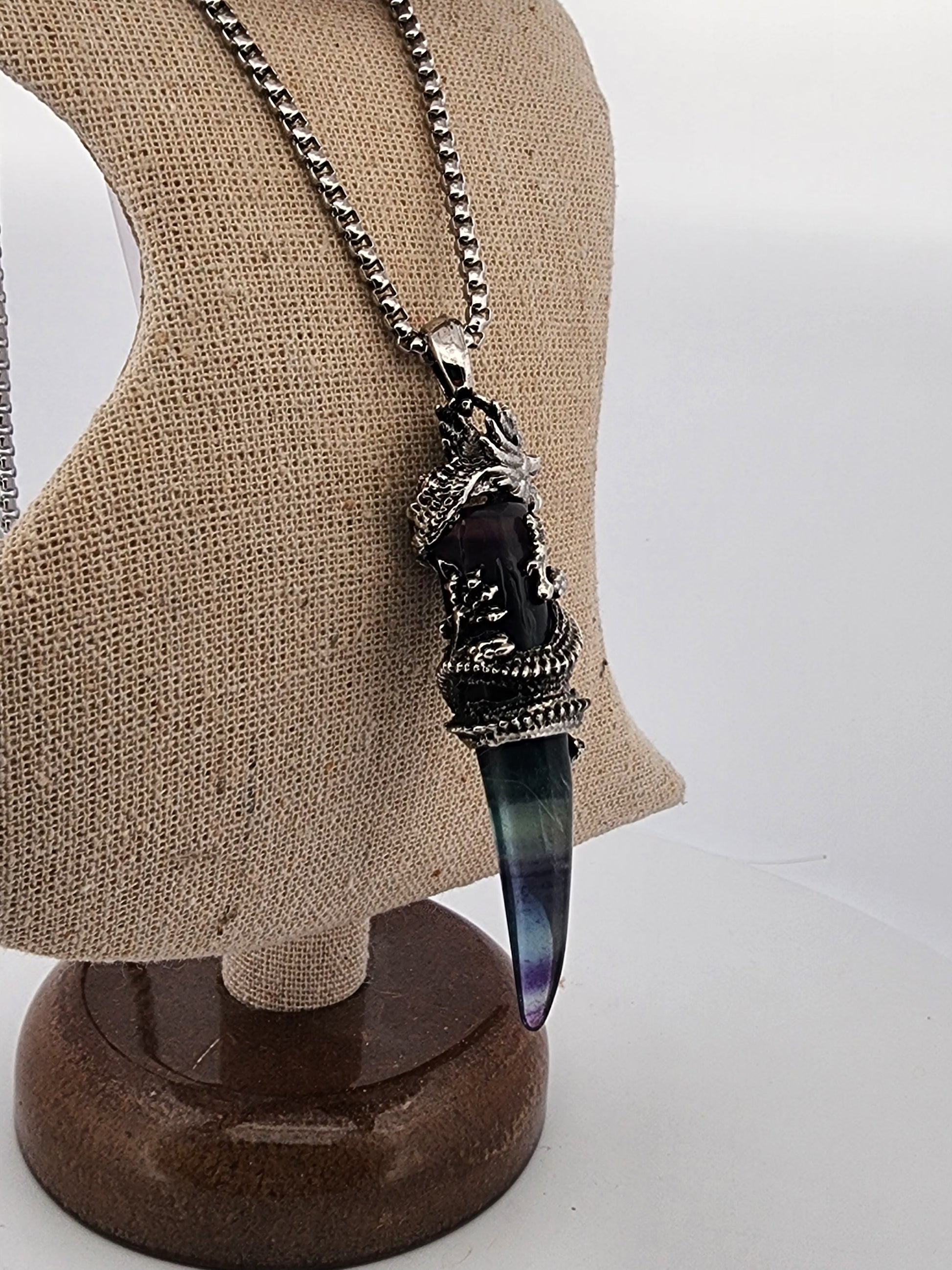 Necklace with a decorative pendant on a mannequin bust