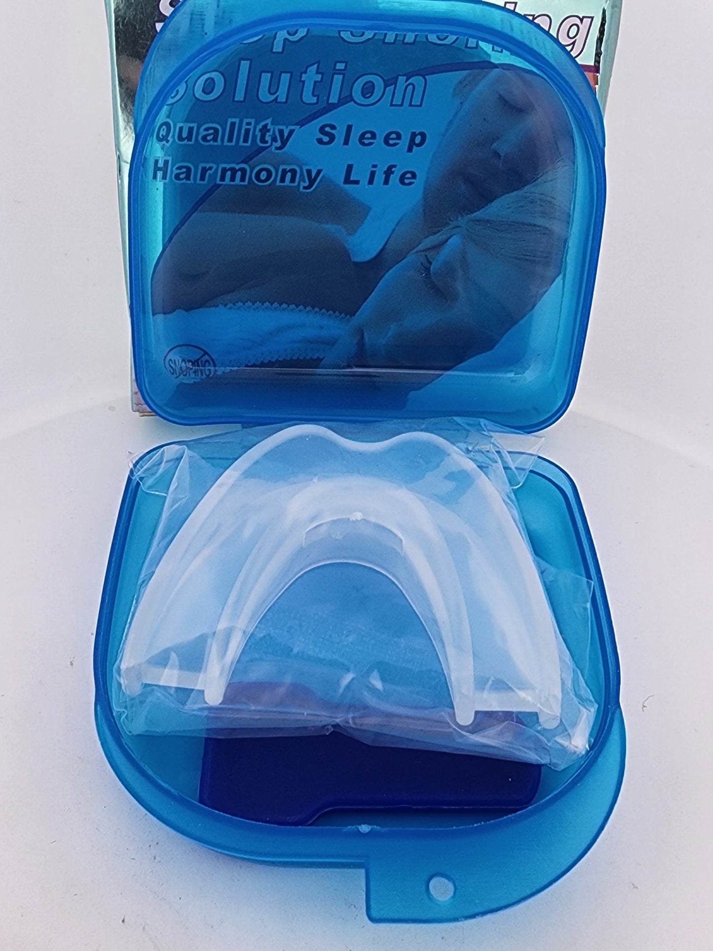 Clear mouthguard in a blue case with text on a white background