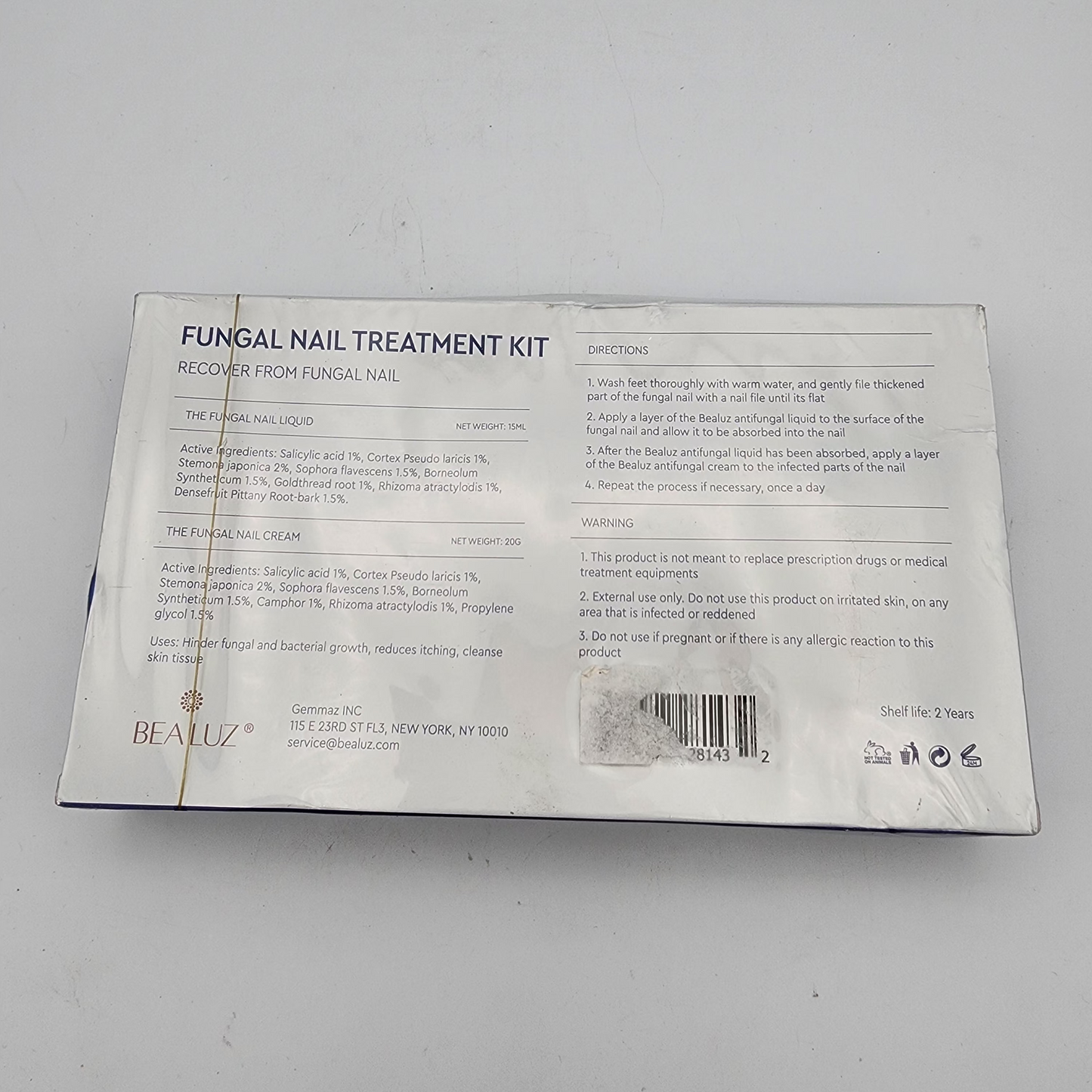 Back of a fungal nail treatment kit packaging on a gray background